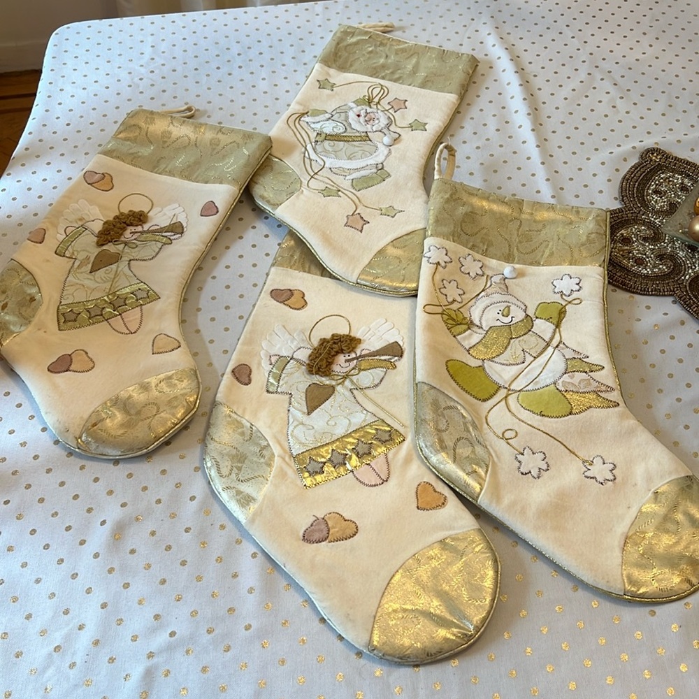 ￼ set of 4 stockings, gold and white very pretty 2angels 1 Santa and 1 snowman